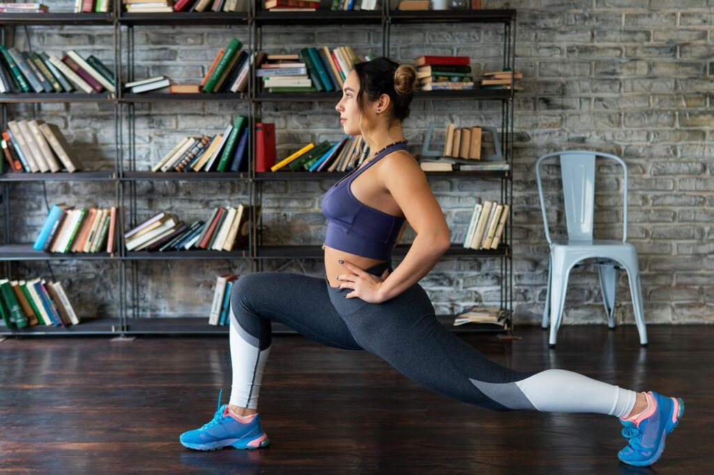 model, girl, sport, woman, fitness, young beautiful athletic woman, performs fitness exercise, dark gray brick wall, bookshelves in the background, dark brown wooden floor, women's sportswear, gray fitness, gray exercise, gray dark, gray workout, gray sports, fitness, fitness, fitness, fitness, fitness, women's sportswear, women's sportswear